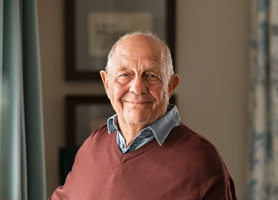 happy senior man smiling at camera